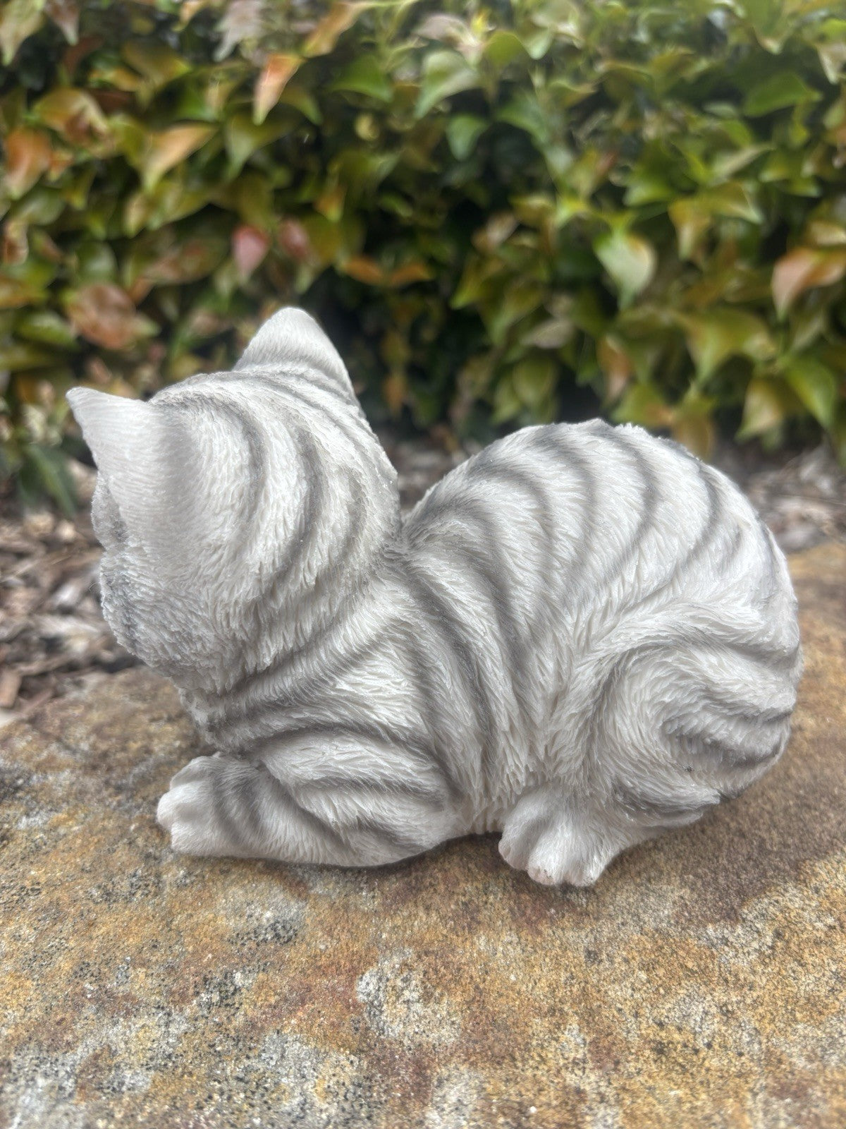 22nice4me Garden Statues sleeping grey tabby cat ornament with textured fur, shown from a side angle on a stone base.