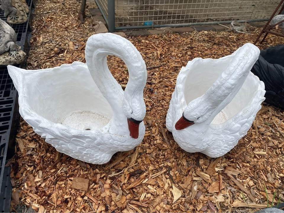 Pair of 22nice4me Garden Statues white concrete swan planters with textured feather details on wood chip ground