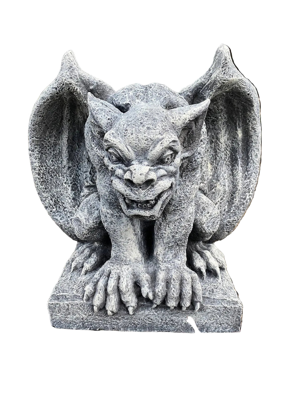 A gray stone-gothic gargoyle garden statue with wings spread, positioned outdoors on a bed of mulch with green foliage in the background.
