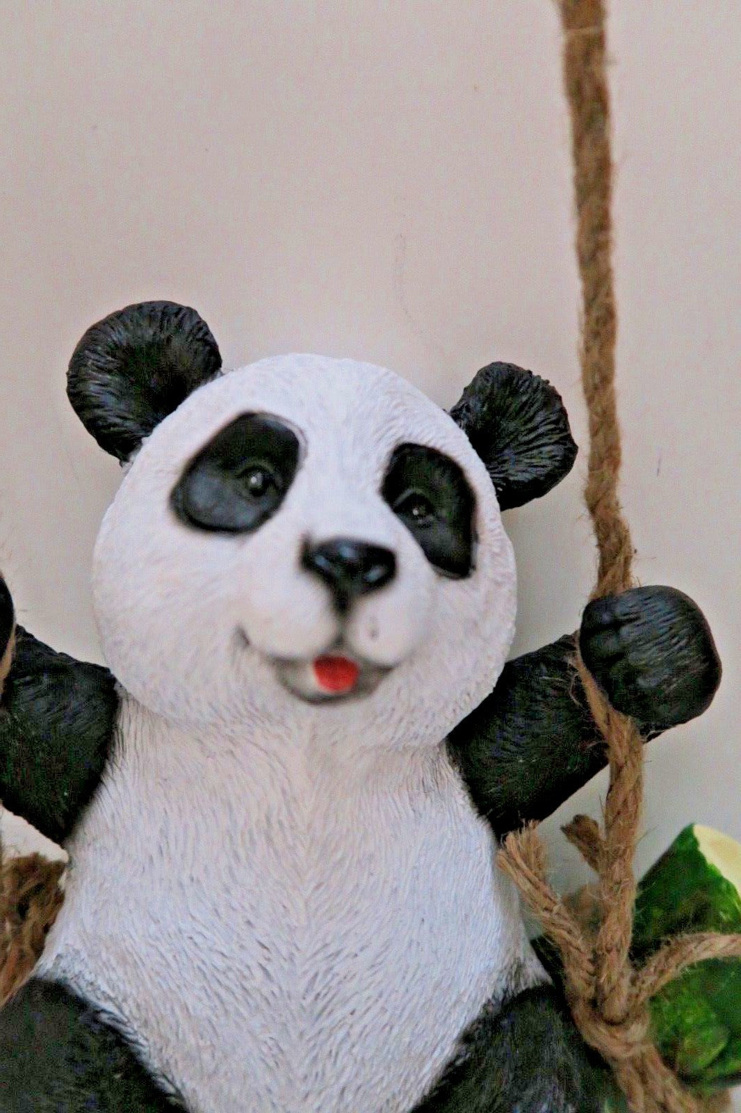 HANGING PANDA ON LOG  GARDEN STATUE