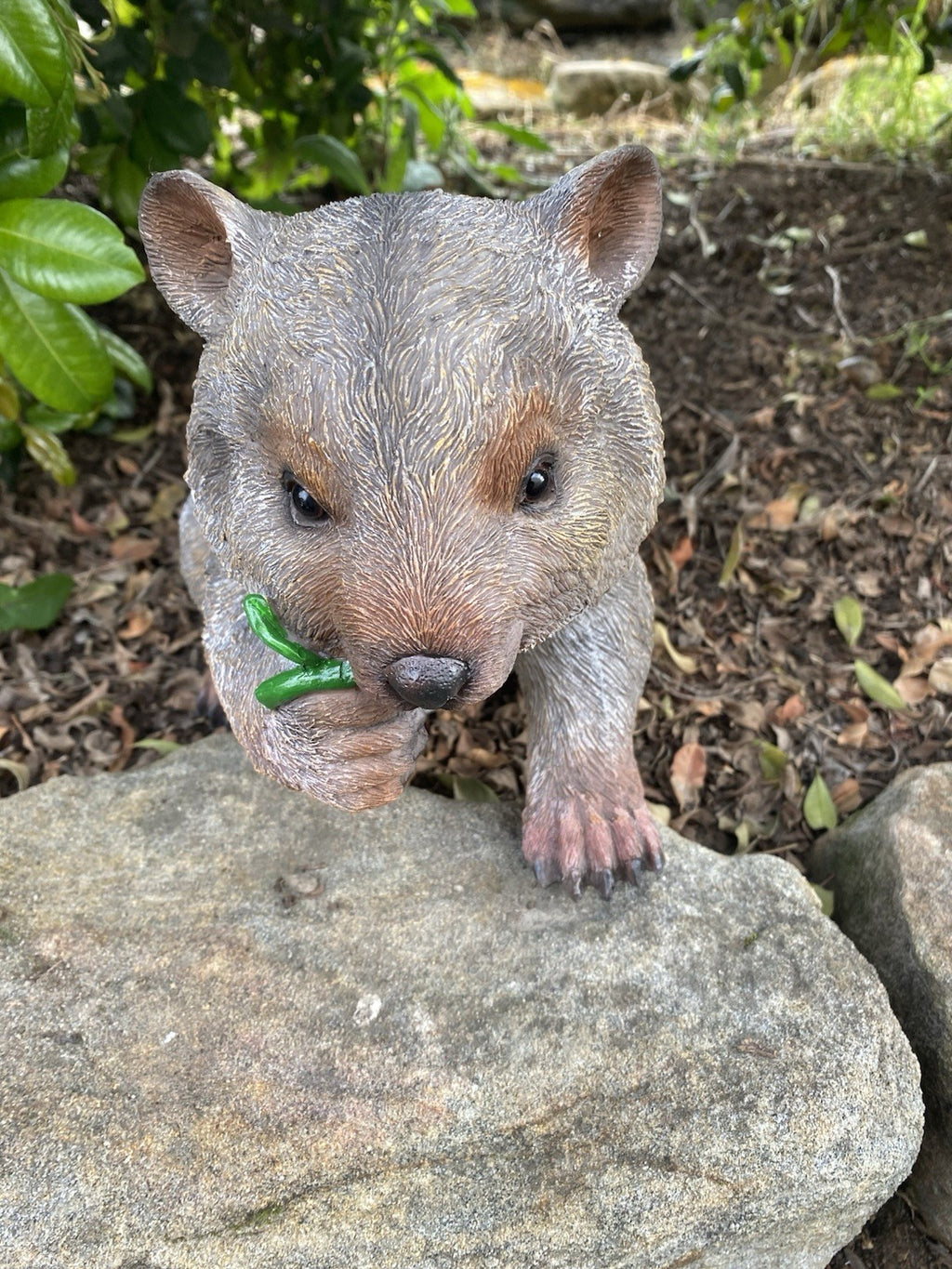 AUSTRALIAN WOMBAT EATING A LEAF GARDEN STATUE