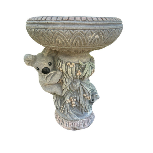 concrete bird bath featuring a detailed koala and eucalyptus design in grey stone finish