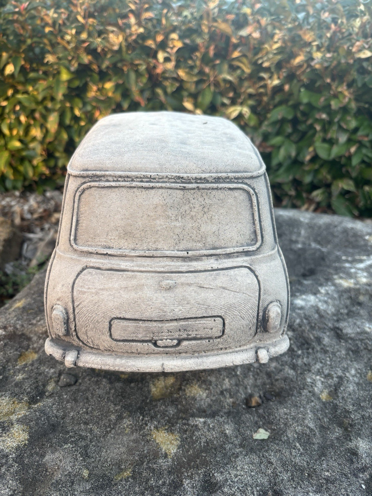 22nice4me Garden Statues concrete Mini Minor car ornament with detailed rear view, set on a stone surface.