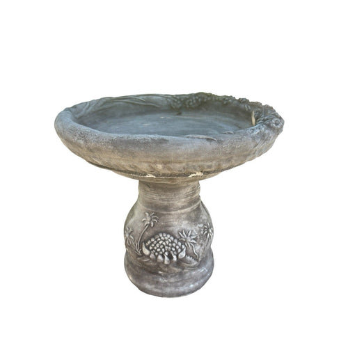 grey concrete bird bath featuring a decorative Australian waratah flower design