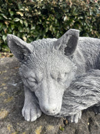 handcrafted grey concrete fox statue in a sleeping pose, detailed fur texture for outdoors.