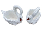 White Swan concrete planter filled with colourful flowers in an outdoor garden